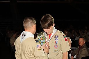 A new Eagle Scout receiving his neckerchief