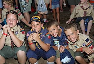 Cub Scouts and Scouts BSA members smiling in Uniforms