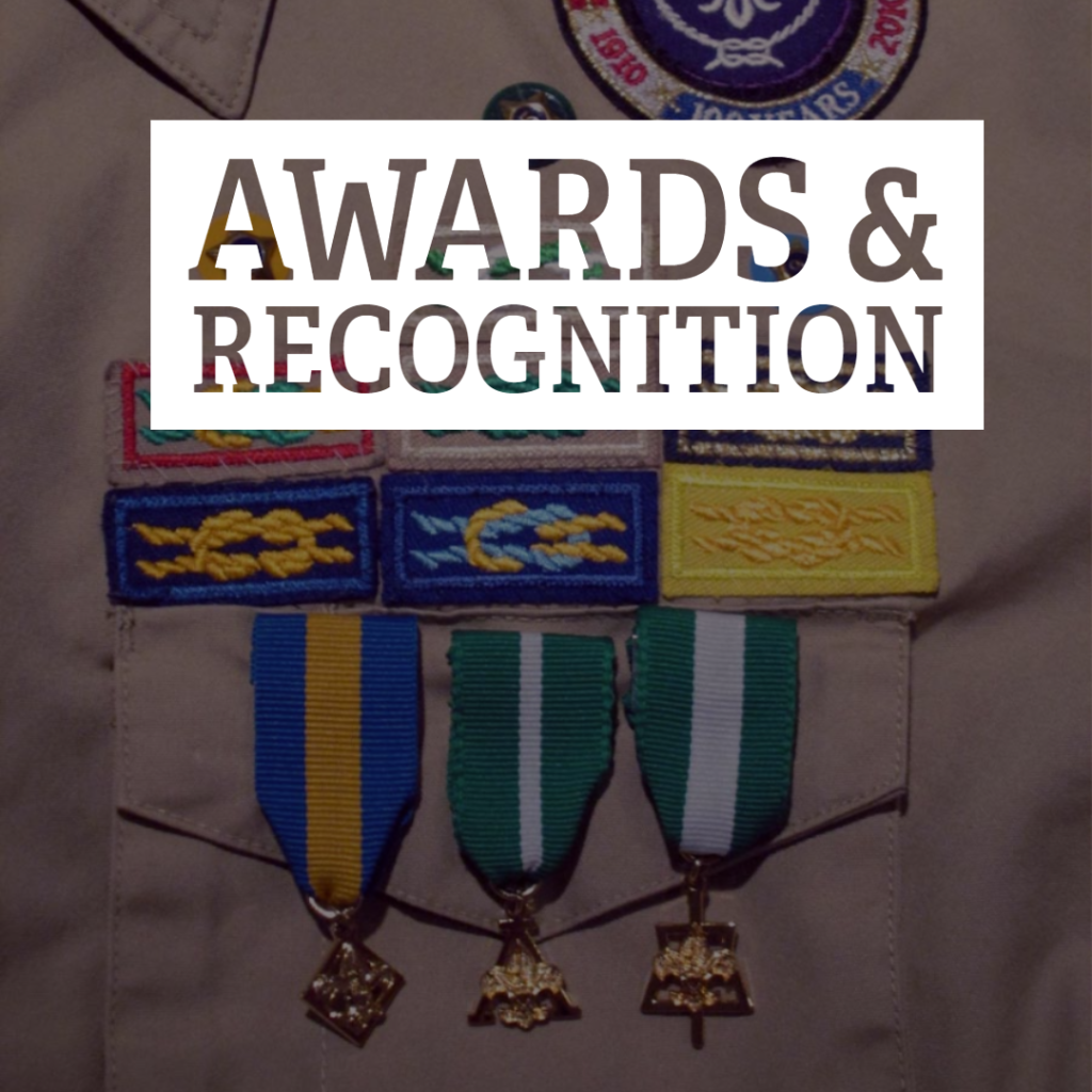Awards & recognition wording over a ScoutsBSA uniform with awards on pocket