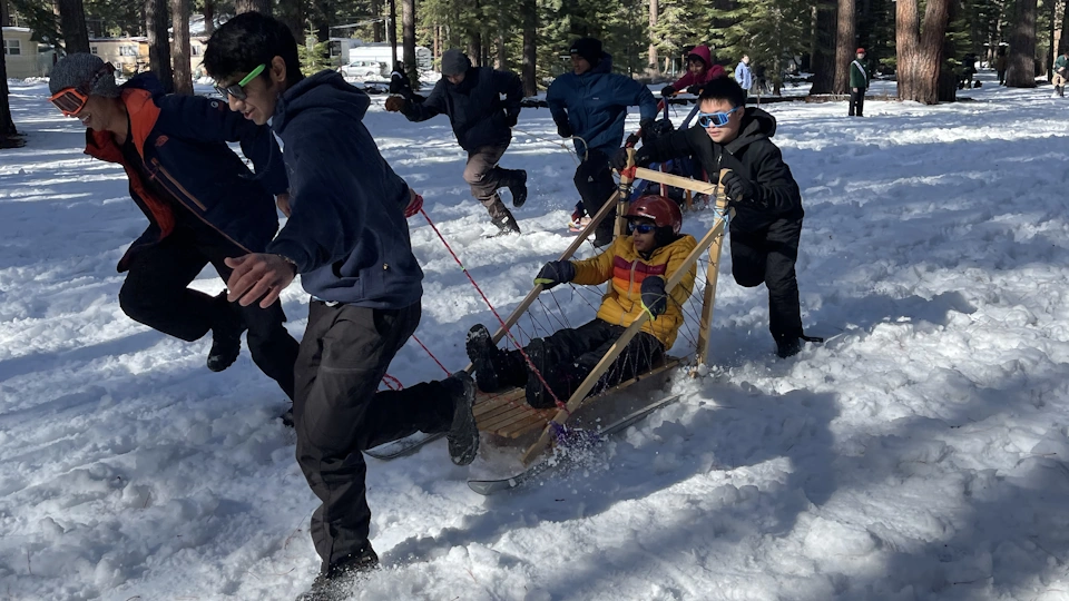 Scouts pulling sled at Klondike Derby